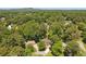 Aerial view of home surrounded by dense trees in a quiet residential area at 1850 Linnet Ne Ct, Roswell, GA 30075