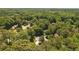 Overhead view of a home nestled in a lush, green, wooded neighborhood at 1850 Linnet Ne Ct, Roswell, GA 30075