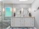 Modern bathroom features a double vanity, granite countertops, and glass shower at 1850 Linnet Ne Ct, Roswell, GA 30075