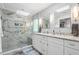 Bright bathroom with walk-in shower and dual vanity with quartz counters at 1850 Linnet Ne Ct, Roswell, GA 30075