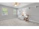 Tranquil bedroom with rocking chair and decorative shelves at 1850 Linnet Ne Ct, Roswell, GA 30075