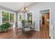 Bright dining area featuring views of the backyard and hardwood floors at 1850 Linnet Ne Ct, Roswell, GA 30075
