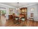 Formal dining room with hardwood floors, decorative chandelier, and elegant furnishings at 1850 Linnet Ne Ct, Roswell, GA 30075
