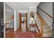 Inviting foyer with hardwood floors, staircase, and views into the adjacent living spaces at 1850 Linnet Ne Ct, Roswell, GA 30075