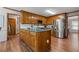 An eat-in kitchen is decorated with stainless steel appliances and custom cabinets with an island at 1850 Linnet Ne Ct, Roswell, GA 30075