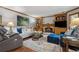 Cozy living room features a fireplace, plush seating, and warm decor at 1850 Linnet Ne Ct, Roswell, GA 30075