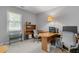 Bright home office with large window and functional desk setup at 1850 Linnet Ne Ct, Roswell, GA 30075