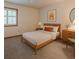 Bright staged bedroom featuring carpet, light walls, and a bed with matching furniture at 2174 Kinridge Rd, Marietta, GA 30062