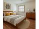 Stylish bedroom with light colored walls, hard wood floors, and modern furniture at 2174 Kinridge Rd, Marietta, GA 30062