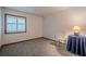 Bedroom with neutral carpet, light walls, and window for natural light at 2174 Kinridge Rd, Marietta, GA 30062
