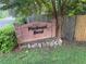Charming brick entrance sign for Piedmont Bend community featuring lush greenery and decorative rock border at 2174 Kinridge Rd, Marietta, GA 30062