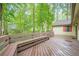 Expansive wood deck with built-in bench seating, providing a perfect setting for relaxation at 2174 Kinridge Rd, Marietta, GA 30062