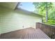Side view of wooden deck surrounded by lush greenery, perfect for enjoying the outdoors at 2174 Kinridge Rd, Marietta, GA 30062