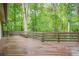 Spacious wood deck overlooking a lush, wooded backyard offers a serene outdoor retreat at 2174 Kinridge Rd, Marietta, GA 30062