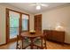 Cozy dining area with access to a wooden deck and natural light at 2174 Kinridge Rd, Marietta, GA 30062