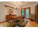 Charming dining area with a chandelier and a view of the outdoor deck at 2174 Kinridge Rd, Marietta, GA 30062