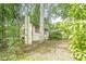 Exterior view of a charming home surrounded by lush trees and foliage, offering a private and serene setting at 2174 Kinridge Rd, Marietta, GA 30062