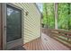 Exterior view of house featuring a wooden deck and siding that complements the natural surroundings at 2174 Kinridge Rd, Marietta, GA 30062