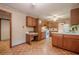 Spacious kitchen featuring wood cabinets, white appliances, and a built-in desk at 2174 Kinridge Rd, Marietta, GA 30062