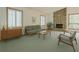 Bright living room featuring a stone fireplace, plantation shutters, and comfortable seating arrangement at 2174 Kinridge Rd, Marietta, GA 30062