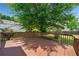 View of a spacious backyard wooden deck with an adjacent concrete patio and lush landscaping at 3020 River Oak Mews, Decatur, GA 30034