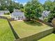 Spacious, fenced backyard featuring a well-maintained lawn and inviting deck, perfect for outdoor entertaining at 3020 River Oak Mews, Decatur, GA 30034
