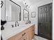 A stylish bathroom features a double sink vanity with modern fixtures and a sleek, framed mirror at 3020 River Oak Mews, Decatur, GA 30034