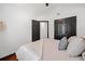 Bright bedroom featuring hardwood floors, ample natural light, and an adjacent closet with double doors at 3020 River Oak Mews, Decatur, GA 30034