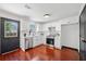 Bright kitchen with stainless steel appliances, shaker cabinets, hardwood floors, and a door leading to backyard at 3020 River Oak Mews, Decatur, GA 30034