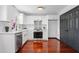 Bright, modern kitchen with stainless steel appliances, new countertops, and fresh backsplash at 3020 River Oak Mews, Decatur, GA 30034