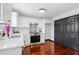 White and bright kitchen with hardwood floors, stone countertops, and stainless steel appliances at 3020 River Oak Mews, Decatur, GA 30034
