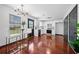 Modern kitchen featuring stylish bar stool seating, white cabinets, and hardwood floors at 3020 River Oak Mews, Decatur, GA 30034