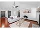 Bright and airy living room with hardwood floors, contemporary furniture, and a view into the modern kitchen at 3020 River Oak Mews, Decatur, GA 30034