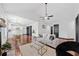 Open concept living space with hardwood floors and a vaulted ceiling adjacent to the modern kitchen at 3020 River Oak Mews, Decatur, GA 30034
