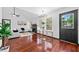 Bright living room featuring hardwood floors, a fireplace, and large windows for natural light at 3020 River Oak Mews, Decatur, GA 30034
