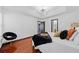 A stunning main bedroom showcases a tray ceiling with a modern light fixture and rich, gleaming hardwood floors at 3020 River Oak Mews, Decatur, GA 30034