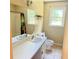 Bathroom featuring a shower-tub combo, tile flooring, and a vanity with a large mirror at 401 Mount Tabor Church Rd, Dallas, GA 30157