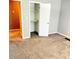 Bedroom featuring gray walls, neutral carpet, and a closet for ample storage at 401 Mount Tabor Church Rd, Dallas, GA 30157