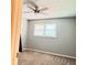 Neat bedroom with carpet, a ceiling fan, and a bright window for natural light at 401 Mount Tabor Church Rd, Dallas, GA 30157