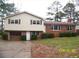 Charming two-story home featuring a brick facade, attached garage, and well-maintained landscaping at 401 Mount Tabor Church Rd, Dallas, GA 30157