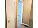 Hallway featuring neutral walls, with rooms leading to the bedrooms at 401 Mount Tabor Church Rd, Dallas, GA 30157