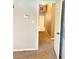 Hallway with carpet flooring, and a view to a doorway at 401 Mount Tabor Church Rd, Dallas, GA 30157