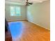 Spacious living room featuring hardwood floors and a ceiling fan for added comfort at 401 Mount Tabor Church Rd, Dallas, GA 30157