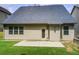 Exterior view of the home showcasing a well-maintained backyard with grass and concrete at 555 Lance View Ln, Lawrenceville, GA 30045