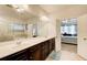 Primary bathroom featuring double sinks, a soaking tub and a walk in shower at 555 Lance View Ln, Lawrenceville, GA 30045