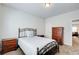 Comfortable bedroom with a metal bed frame, two nightstands and dresser at 555 Lance View Ln, Lawrenceville, GA 30045