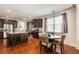 Bright kitchen featuring a center island, stainless appliances, and a round breakfast table next to a window at 555 Lance View Ln, Lawrenceville, GA 30045