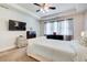 Bright main bedroom featuring a tray ceiling and bedside lamps at 555 Lance View Ln, Lawrenceville, GA 30045