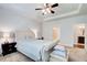 Bright main bedroom featuring a tray ceiling and bedside lamps at 555 Lance View Ln, Lawrenceville, GA 30045