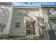 A view of the backyard, including a sliding glass door and light-colored siding at 6540 Arbor Gate Sw Dr # 3, Mableton, GA 30126